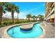 Resort-style lazy river pool surrounded by palm trees and lounge chairs for ultimate relaxation at 603 S Ocean Blvd. # 912, North Myrtle Beach, SC 29582