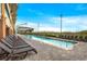 Outdoor pool with rows of lounge chairs, shade umbrellas, and ocean views at 603 S Ocean Blvd. # 912, North Myrtle Beach, SC 29582