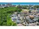 Aerial view pinpointing the property's location within a community, near lush greenery and a glimpse of the ocean at 634 Cypress Ln., North Myrtle Beach, SC 29582