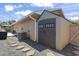 Backyard featuring a storage shed, gravel landscaping, stone walkway, and partial view of patio area at 634 Cypress Ln., North Myrtle Beach, SC 29582