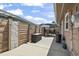 Spacious backyard featuring a patio area, privacy fence, outdoor storage, and landscaping at 634 Cypress Ln., North Myrtle Beach, SC 29582