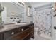 Bathroom featuring dark wood vanity, beach themed decorations and shower curtain at 634 Cypress Ln., North Myrtle Beach, SC 29582