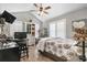 Bright bedroom with vaulted ceiling, shuttered windows, patterned quilt, workspace, and modern decor at 634 Cypress Ln., North Myrtle Beach, SC 29582