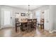 Cozy dining room featuring a wooden table set, chandelier lighting, and seaside-inspired decor at 634 Cypress Ln., North Myrtle Beach, SC 29582