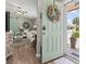 Inviting entryway showcasing a charming interior with hardwood floors, a stylish living room, and a peek of natural light at 634 Cypress Ln., North Myrtle Beach, SC 29582