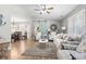 Bright living room with vaulted ceiling, shuttered windows, comfortable seating, and stylish nautical accents at 634 Cypress Ln., North Myrtle Beach, SC 29582