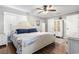 Cozy main bedroom features a ceiling fan, hardwood floors, and neutral wall color at 634 Cypress Ln., North Myrtle Beach, SC 29582