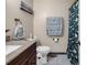 Cozy bathroom featuring granite countertop and complementing blue towels at 6628 Mallard View Point, Myrtle Beach, SC 29588