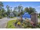 The Myrtle Beach Golf & Yacht Club community sign with flowers and landscaping on a sunny day at 6628 Mallard View Point, Myrtle Beach, SC 29588