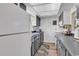 Functional kitchen with gray cabinets, modern appliances, and wood-look flooring at 6628 Mallard View Point, Myrtle Beach, SC 29588