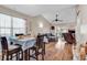 Open-concept living room with dining area, modern furnishings, and lots of sunlight at 6628 Mallard View Point, Myrtle Beach, SC 29588