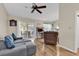 Spacious living room with ceiling fan, wood floors and access to the outdoor patio at 6628 Mallard View Point, Myrtle Beach, SC 29588