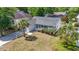 Attractive single-story home with an attached garage, a cozy front porch, and palm trees at 68 Voyagers Dr., Pawleys Island, SC 29585