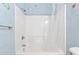 Bathroom features shower with plastic curtain, and blue painted walls at 68 Voyagers Dr., Pawleys Island, SC 29585