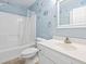 Bathroom features vanity, toilet, and shower with blue accents and coastal decor at 68 Voyagers Dr., Pawleys Island, SC 29585