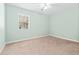Bedroom featuring neutral walls, carpet flooring, and a bright window at 68 Voyagers Dr., Pawleys Island, SC 29585