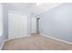 Bedroom with neutral carpet, light blue walls, double door closet and ceiling fan at 68 Voyagers Dr., Pawleys Island, SC 29585