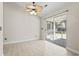 Dining room with sliding glass doors to a back patio and decorative ceiling fan at 68 Voyagers Dr., Pawleys Island, SC 29585