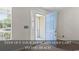A beautiful light blue door opens to the front yard at 68 Voyagers Dr., Pawleys Island, SC 29585