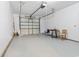 Spacious garage with white walls, a garage door, and space for storage or parking at 68 Voyagers Dr., Pawleys Island, SC 29585