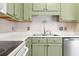 Traditional kitchen design featuring painted green cabinetry and laminate countertops at 68 Voyagers Dr., Pawleys Island, SC 29585
