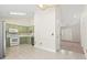 Open kitchen with tile flooring, painted cabinets, and modern appliances at 68 Voyagers Dr., Pawleys Island, SC 29585