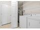 Laundry room with washer, dryer, and wire shelving for storage at 68 Voyagers Dr., Pawleys Island, SC 29585