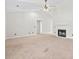 Bright living room featuring high ceilings, a fireplace, and neutral carpet at 68 Voyagers Dr., Pawleys Island, SC 29585