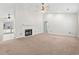 Spacious living room with neutral carpet, a fireplace, and a ceiling fan, perfect for relaxing at 68 Voyagers Dr., Pawleys Island, SC 29585