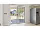 View of outdoor patio and fenced backyard from the dining room at 68 Voyagers Dr., Pawleys Island, SC 29585