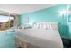 Bright bedroom features a plush bed, cozy seating area, and balcony access with outside view at 6803 N Ocean Blvd. # 328, Myrtle Beach, SC 29572