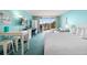 Bright living area features a plush bed, cozy seating area, a desk, and balcony access at 6803 N Ocean Blvd. # 328, Myrtle Beach, SC 29572