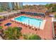 Resort-style pool surrounded by lounge chairs and umbrellas, offering a relaxing outdoor space at 6803 N Ocean Blvd. # 328, Myrtle Beach, SC 29572