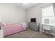 Cozy bedroom with pink accents, carpeted floors, and a vanity area with good lighting at 712 Hobonny Loop, Longs, SC 29568
