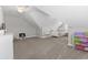 Bonus room with sloped ceilings, neutral carpet, a ceiling fan, a bed and dresser at 712 Hobonny Loop, Longs, SC 29568