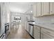 Bright kitchen featuring stainless steel appliances, white cabinetry, and a marble countertop, perfect for cooking and entertaining at 712 Hobonny Loop, Longs, SC 29568