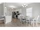 Open floorplan of kitchen and dining area featuring modern appliances and lots of natural light at 712 Hobonny Loop, Longs, SC 29568