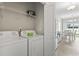 Laundry room with a washer and dryer; doorway opens to the dining room at 712 Hobonny Loop, Longs, SC 29568