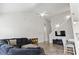 Spacious living room with high ceilings, a cozy sectional sofa, and plenty of natural light, perfect for relaxation at 712 Hobonny Loop, Longs, SC 29568