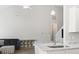 Open-concept living room featuring modern decor, hardwood floors, and vaulted ceilings at 712 Hobonny Loop, Longs, SC 29568