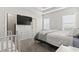 Spacious main bedroom with tray ceilings, walk-in closet, and lots of natural light at 712 Hobonny Loop, Longs, SC 29568