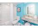 Well-lit bathroom featuring a shower-tub combo and decorative wall art at 7200 N Ocean Blvd. # 1058, Myrtle Beach, SC 29572