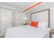 Bedroom featuring a king-sized bed, closet access, and bedside tables with soft lighting at 7200 N Ocean Blvd. # 1058, Myrtle Beach, SC 29572