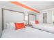 Spacious bedroom with two beds, stylish headboards, and ample lighting at 7200 N Ocean Blvd. # 1058, Myrtle Beach, SC 29572