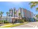 Condo complex exterior with multiple floors and palm trees surrounding, offering a tropical vacation vibe at 7200 N Ocean Blvd. # 1058, Myrtle Beach, SC 29572