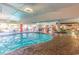 Inviting indoor pool with a lazy river feature, seating areas, and tropical decor for year-round enjoyment at 7200 N Ocean Blvd. # 1058, Myrtle Beach, SC 29572