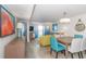 Bright living room features coastal decor, comfortable seating, and a dining area with seating for four at 7200 N Ocean Blvd. # 1058, Myrtle Beach, SC 29572