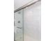 Modern shower with glass door, marble tile, sleek fixtures, and a hand towel bar adding elegance at 7200 N Ocean Blvd. # 1058, Myrtle Beach, SC 29572