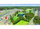 Gorgeous aerial view of home nestled in a community with a golf course, ponds, and green landscape at 747 Gryffindor Dr., Longs, SC 29568