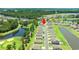 Aerial view of the community showcasing the homes, pond, and golf course at 747 Gryffindor Dr., Longs, SC 29568